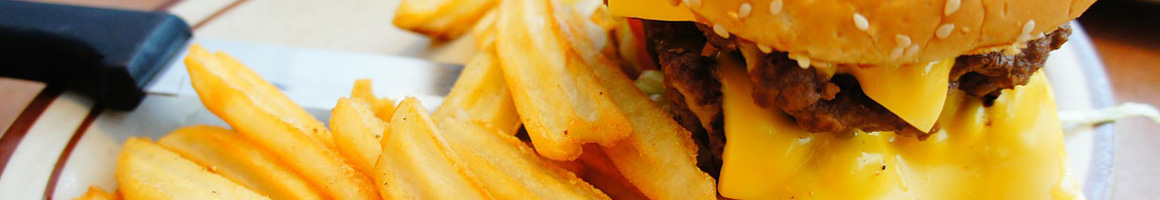 Eating Burger Hot Dog Colombian at Cali Burger restaurant in Elizabeth, NJ.
